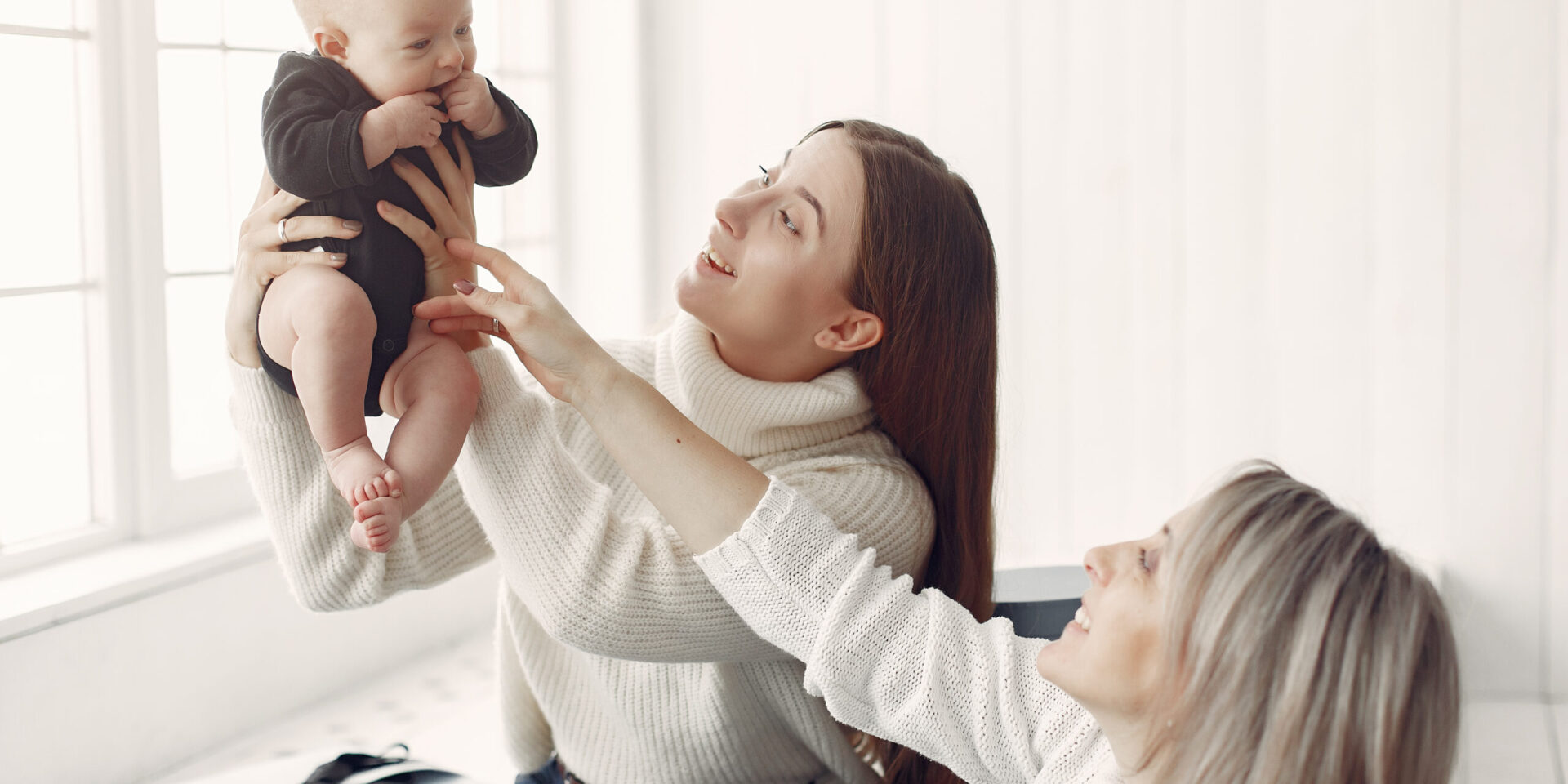 Elegant grandma at home with daughter and granddaughter